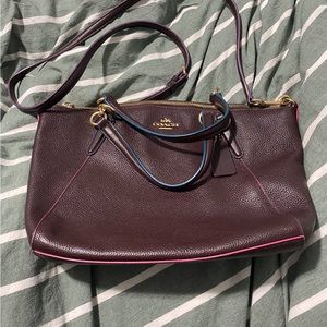 Medium crossbody soft leather coach bag. Burgundy with different color trimming.